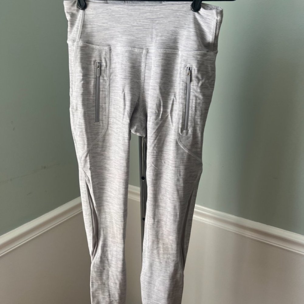 Running tights with zipper pockets - large enough to hold your phone.